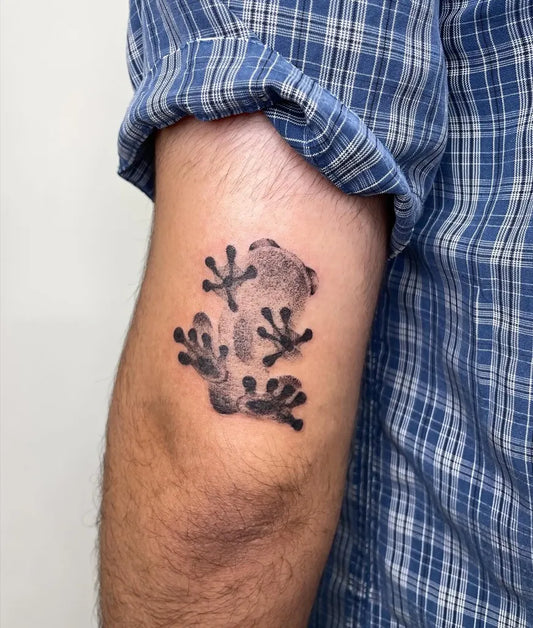 Small Black and Grey Frog Tattoo on Men Arm by @iris.tats