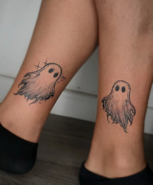 Small Black and Grey Ghost Tattoo on Women Leg by @agnan_tattoo