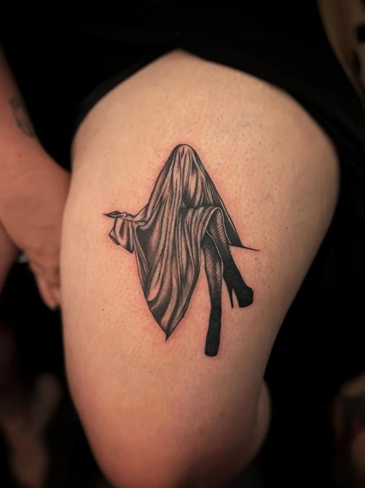 Small Black and Grey Ghost Tattoo on Women Thigh by @sodypop.ink