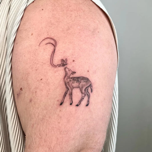 Small Black and Grey Giraffe with Moon Tattoo on Women Shoulder by @hyotattoo