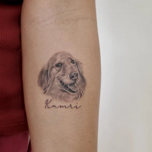Small Black and Grey Golden Retriever Dog Tattoo on Women Arm by @twodogs.tattoo.space