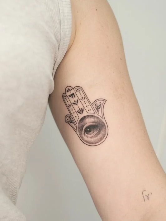 Small Black and Grey Hamsa Evil Eye on Women Arm Tattoo by @lonewolf_studio