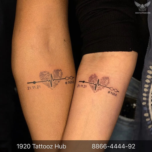 Small Black and Grey Heartbeat Heart Infinity Tattoo on Women Arm by @1920tattoozhub