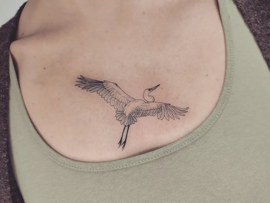 Small Black and Grey Heron Bird Tattoo on Women Shoulder by @fayalicetattoo
