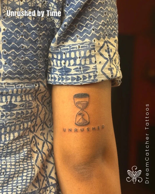Small Black and Grey Hourglass Unrushed Tattoo on Women Arm by @dreamcatcher_tattoos