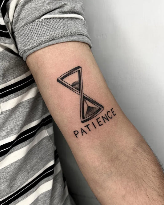 Small Black and Grey Hourglass and Patience Tattoo on Men Arm by @kamayatattoostudio
