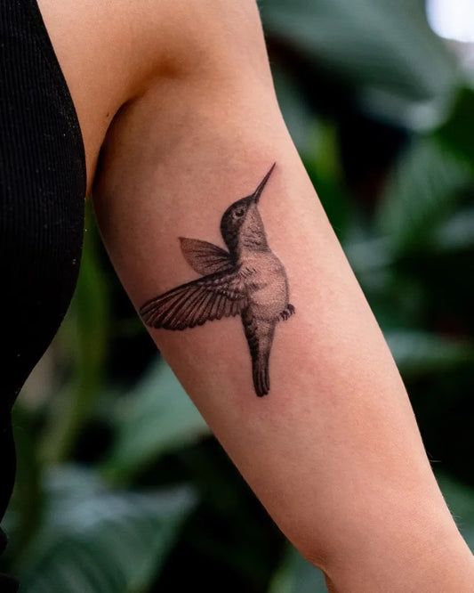 Small Black and Grey Hummingbird on Women Arm Tattoo by @james_seventhson