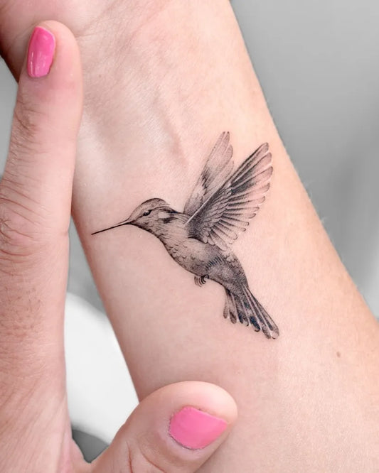 Small Black and Grey Hummingbird on Women Wrist Tattoo by @choiyun_tattoo