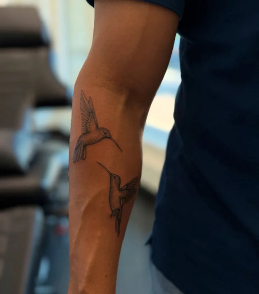 Small Black and Grey Hummingbirds on Men Arm Tattoo by @inkedbyjules_