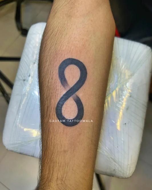 Small Black and Grey Infinity Tattoo on Men Forearm by @gautam_tattoowala_official