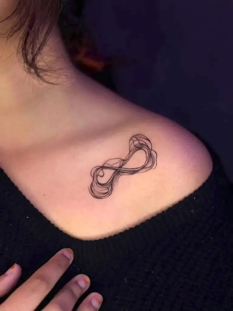 Small Black and Grey Infinity Tattoo on Women Shoulder by @inkkong_tattoo