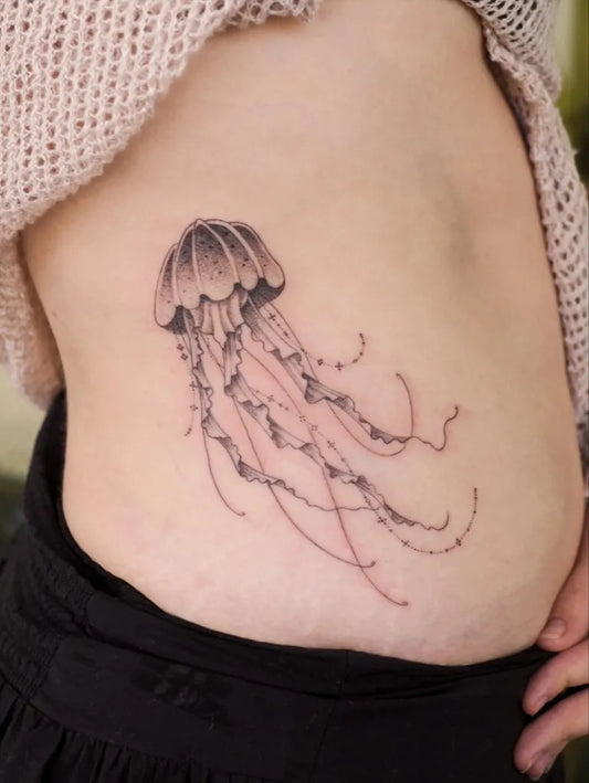 Small Black and Grey Jellyfish Tattoo on Women Side by @movingneedle