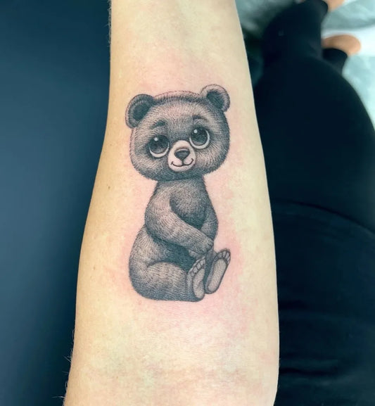 Small Black and Grey Lady Bear on Women Arm Tattoo by @leni_ink