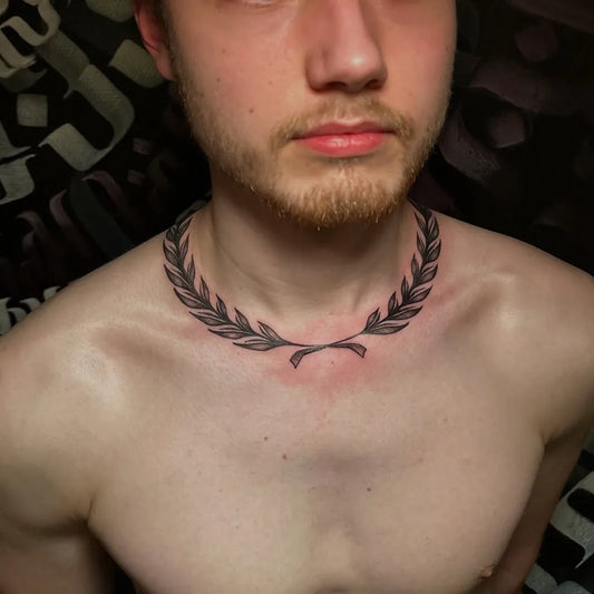 Small Black and Grey Laurel Wreath Tattoo on Men Neck by @muro.tattooart
