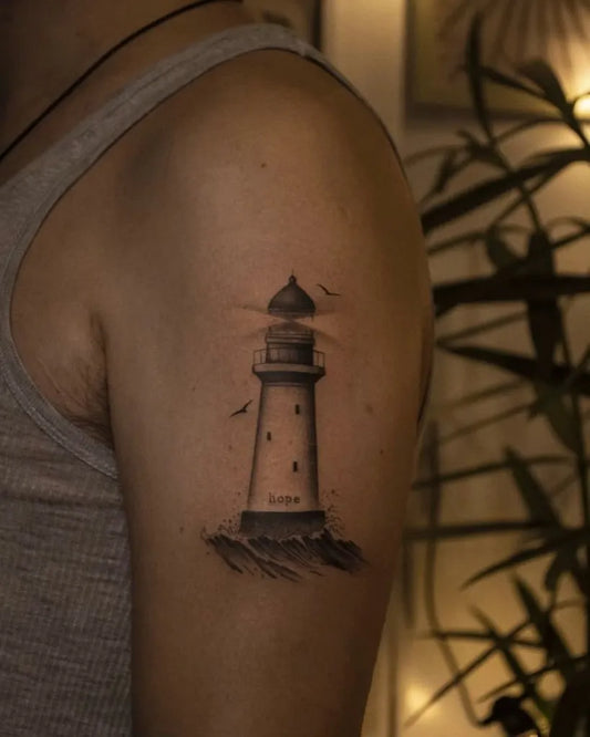 Small Black and Grey Lighthouse with Birds Tattoo on Men Arm by @the.xx.ttt