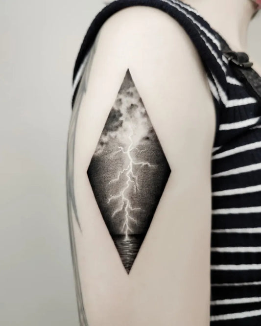 Small Black and Grey Lightning Diamond Tattoo on Women Shoulder by @jamjam.tattoo