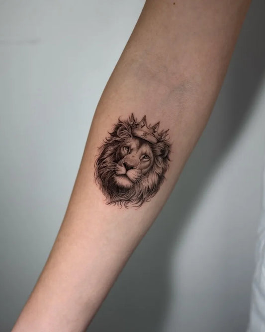Small Black and Grey Lion with Crown on Women Arm Tattoo by @z9_ttt