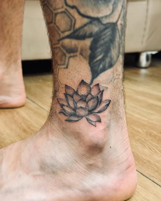 Small Black and Grey Lotus Flower on Men Ankle Tattoo by @bnanatattoo