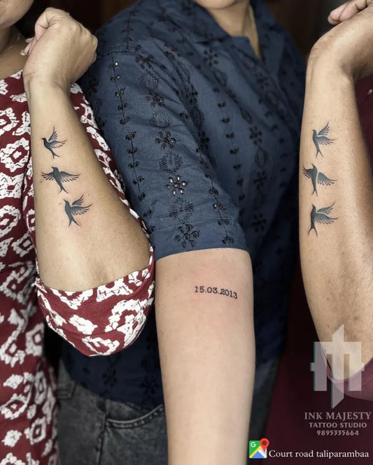 Small Black and Grey Matching Swallow Bird Tattoo on Women Arm by @tattoo_ink_majesty_taliparamba