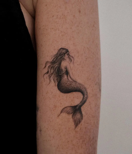 Small Black and Grey Mermaid Tattoo on Women Arm by @tattooist_kao