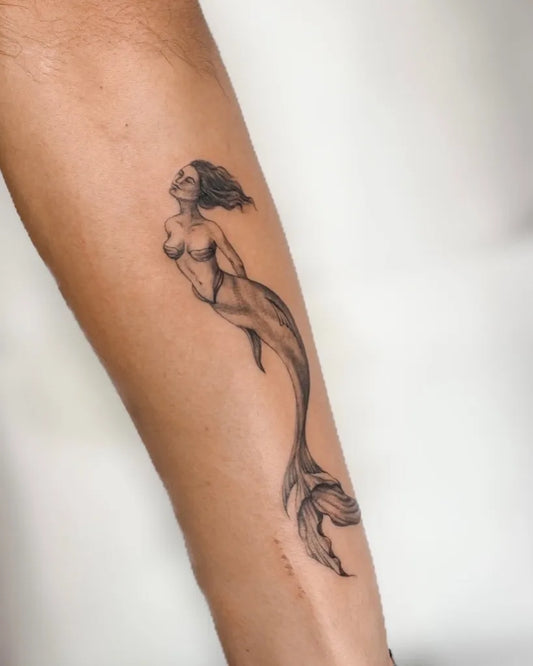 Small Black and Grey Mermaid Tattoo on Women Arm by @theodysseytattoo