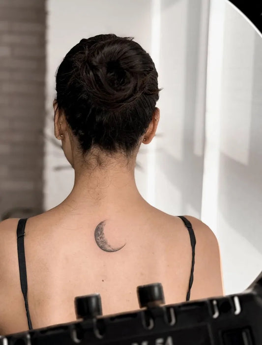 Small Black and Grey Moon Tattoo on Women Back by @zeetattooo