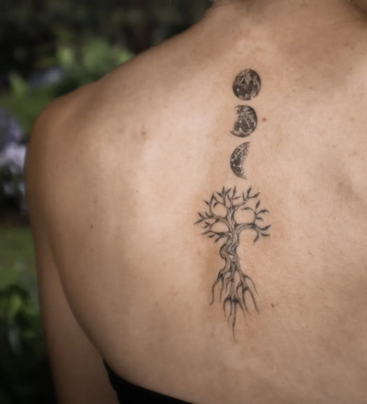 Small Black and Grey Moon Tree of Life Tattoo on Women Back by @nataliactattoo