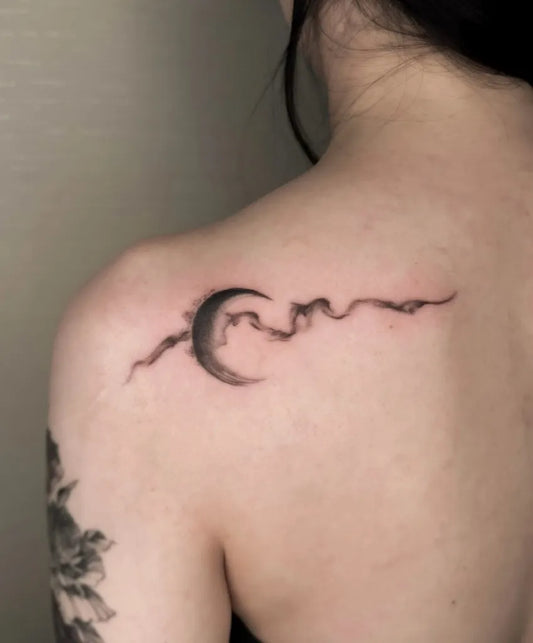 Small Black and Grey Moon and Wave Tattoo on Women Shoulder by @hazetattooist