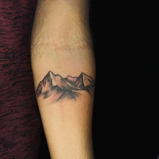 Small Black and Grey Mountain Tattoo on Men Arm by @kathircesar_77