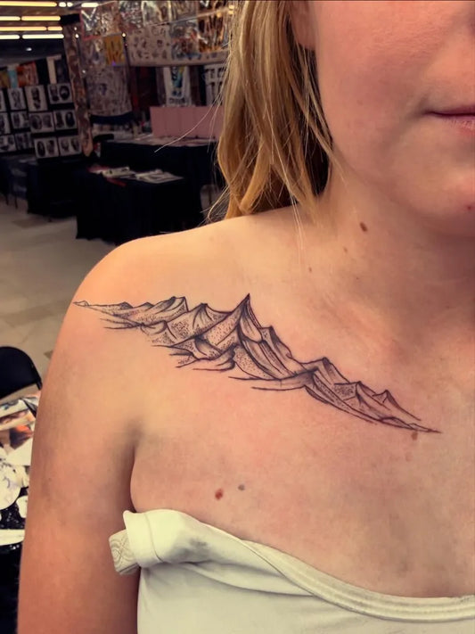 Small Black and Grey Mountain Tattoo on Women Shoulder by @maddys.tattoos.art