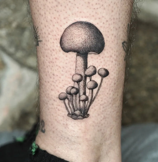 Small Black and Grey Mushroom Cluster on Men Leg Tattoo by @anacronia.tattooer