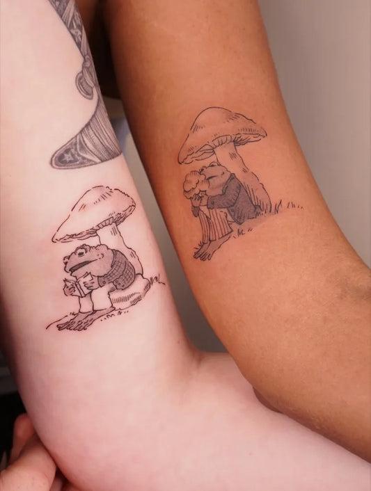 Small Black and Grey Mushroom and Frog on Women Arm Tattoo by @xiaoxiao_ink