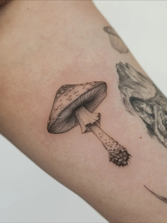 Small Black and Grey Mushroom on Women Arm Tattoo by @wolfdencustomtattoo