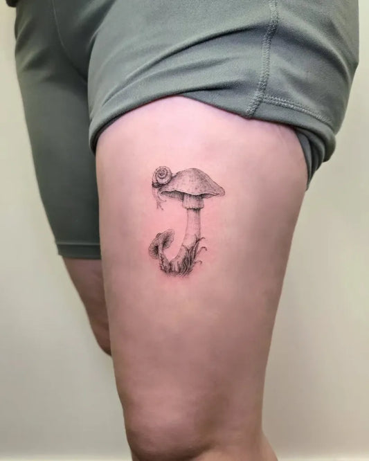 Small Black and Grey Mushroom on Women Thigh Tattoo by @dalette_tattoo