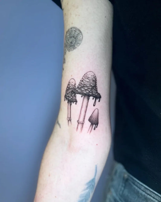 Small Black and Grey Mushrooms on Women Arm Tattoo by @leahtattoos