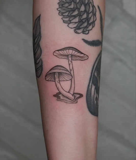 Small Black and Grey Mushrooms on Women Arm Tattoo by @troldahl.tattoo