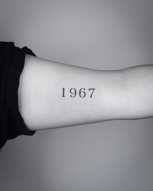 Small Black and Grey Numeric Year Tattoo on Women Arm by @jiyoo_tattoo