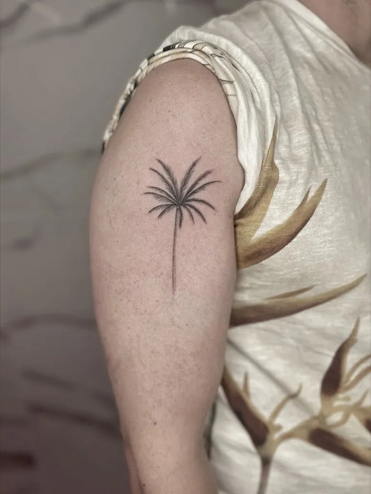 Small Black and Grey Palm Tree Tattoo on Men Arm by @andrea.finelinetattoo