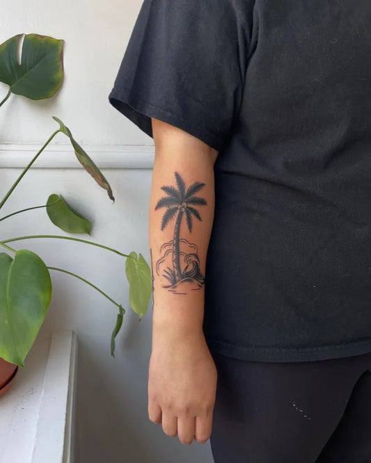 Small Black and Grey Palm Tree Tattoo on Women Forearm by @blackneedle.ttt