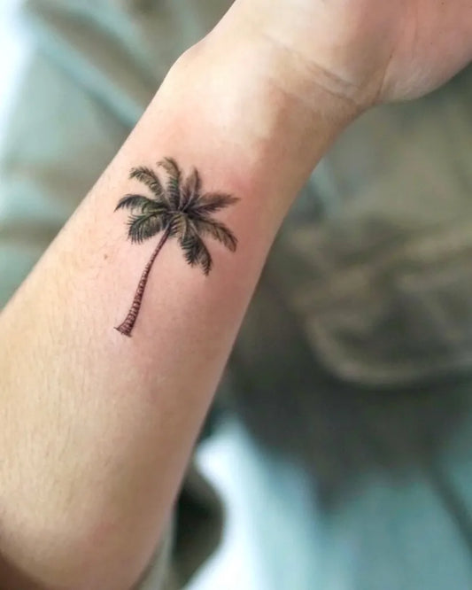 Small Black and Grey Palm Tree Tattoo on Women Wrist by @tattooforest_ed