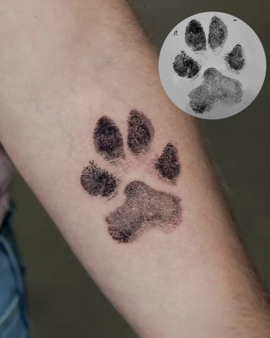 Small Black and Grey Paw Print Tattoo on Men Arm by @hoa._.tattoo