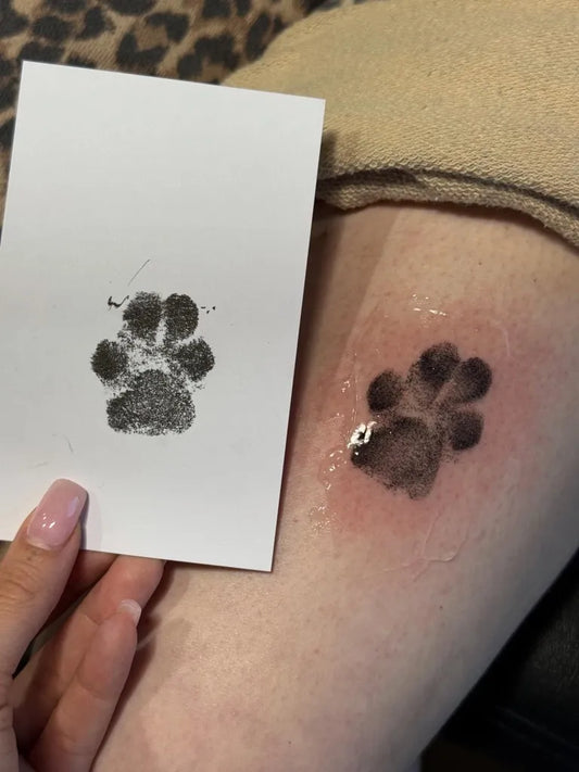 Small Black and Grey Paw Print Tattoo on Women Ankle by @inkedbylina
