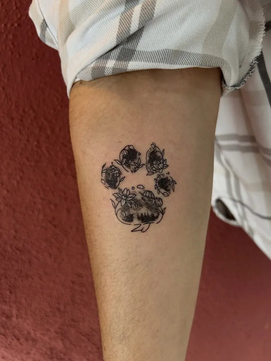 Small Black and Grey Paw Print Tattoo on Women Forearm by @arizona.artistry