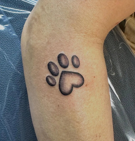Small Black and Grey Paw Print with Heart Tattoo on Women Arm by @allenta2s