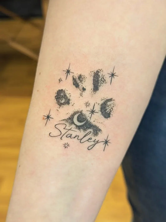 Small Black and Grey Paw Print with Moon and Stars Tattoo on Women Forearm by @siga.sigg