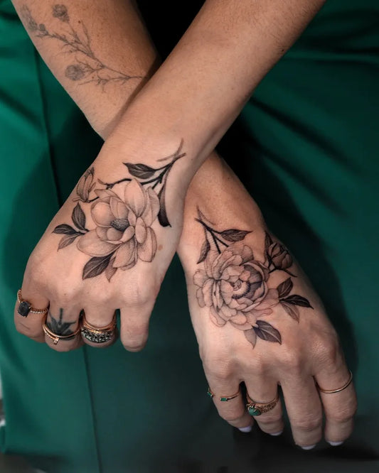 Small Black and Grey Peony and Leaves on Women Wrist Tattoo by @zeetattoo