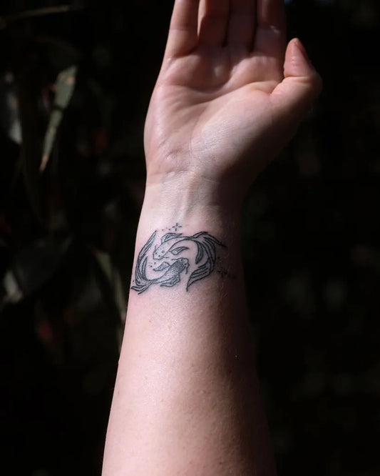 Small Black and Grey Pisces Symbol Tattoo on Women Wrist by @winonaforever_tattoos