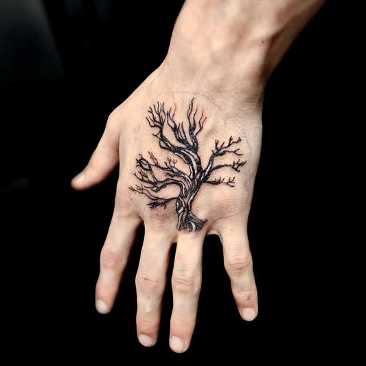 Small Black and Grey Poison Tree on Men Hand Tattoo by @megan_marley_
