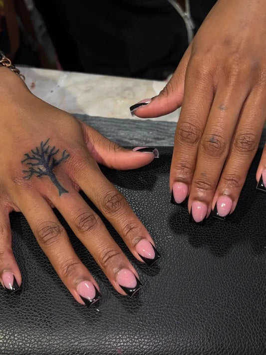 Small Black and Grey Poison Tree on Women Hand Tattoo by @naileddbynii_