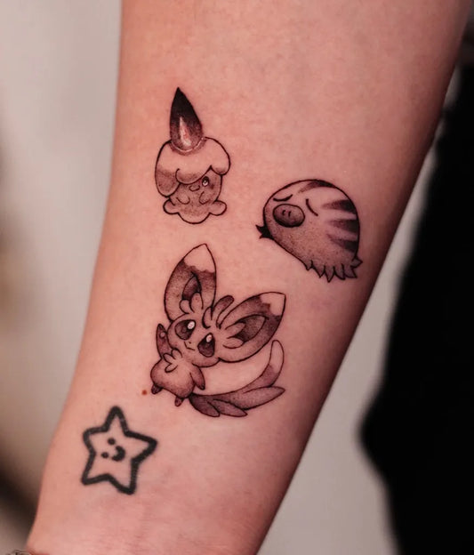 Small Black and Grey Pokemon Tattoo on Women Arm by @domi.nami